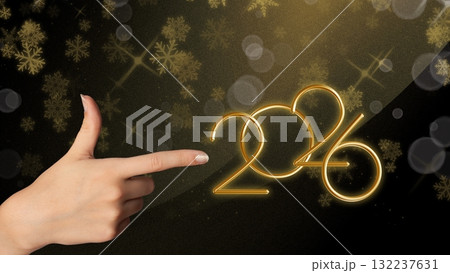 Female hand highlighting golden 2026 numbers with glitter, great for invitations, advertising, and digital campaigns. 132237631