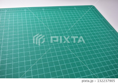 green cutting mat board on white background with line and scale measure guide pattern for art design green cutting mat board on white background with line and scale measure guide pattern for art design 132237905