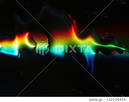 Rainbow is reflected in a puddle of water Rainbow is reflected in a puddle of water 132238454