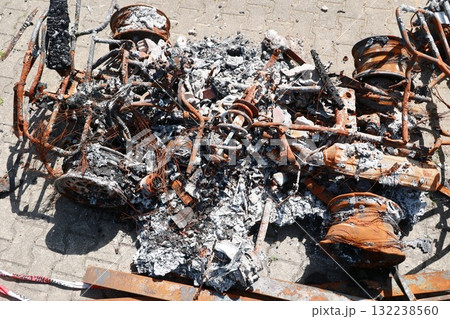 A car is on fire and has been destroyed A car is on fire and has been destroyed 132238560