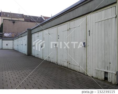 Row of old wooden garages with numbers 1 through 10 Row of old wooden garages with numbers 1 through 10 132239115