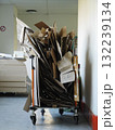 Cart full of cardboard boxes is piled high 132239134