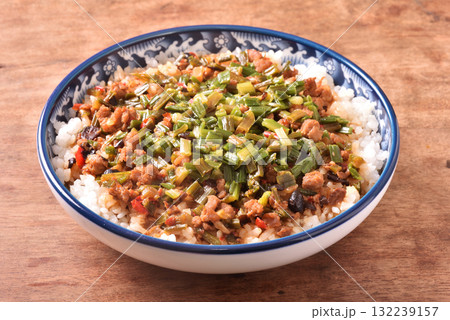 Fried minced pork with chive flower and black bean sauce over rice 132239157