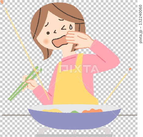 料理中に油がはねて困る女性 132240060