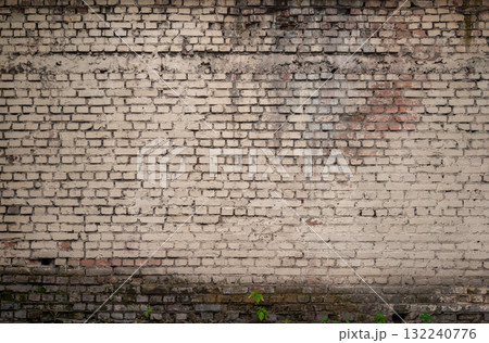Old Brick Wall With Weathered Texture and Natural Decay 132240776