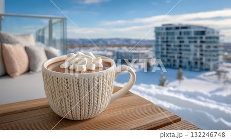 Cozy winter hot chocolate with marshmallow on balcony enjoying snowy view Cozy winter hot chocolate with marshmallow on balcony enjoying snowy view 132246748