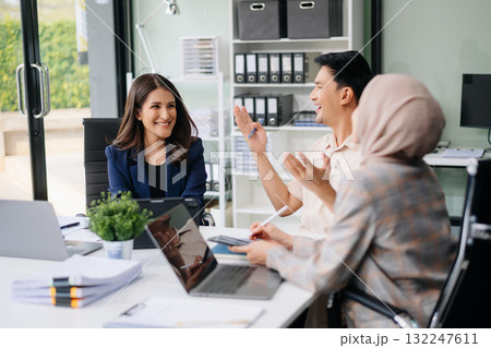 Business team discuss at meeting room. working together with laptop ,tablet and smart phone on desk Financial accountant at office Business team discuss at meeting room. working together with laptop ,tablet and smart phone on desk Financial accountant at office 132247611