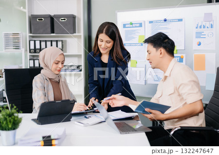 Business team discuss at meeting room. working together with laptop ,tablet and smart phone on desk Financial accountant at office Business team discuss at meeting room. working together with laptop ,tablet and smart phone on desk Financial accountant at office 132247647