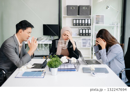 Furious Asian businesspeople arguing strongly after making a mistake at work in office Furious Asian businesspeople arguing strongly after making a mistake at work in office 132247694