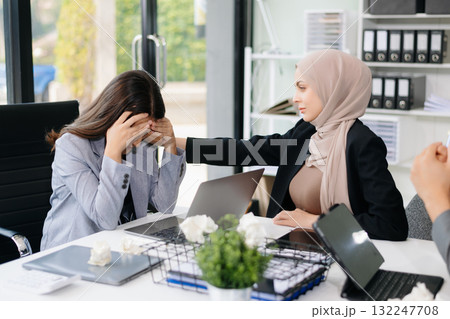 Furious Asian businesspeople arguing strongly after making a mistake at work in office 132247708