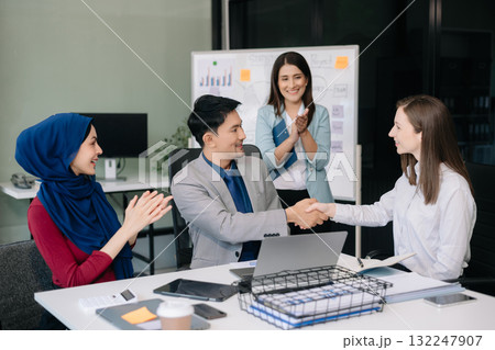 Business partnership handshake concept.Photo two coworkers handshaking process. Business partnership handshake concept.Photo two coworkers handshaking process. 132247907