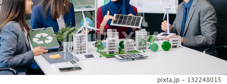 Group of alternative energy engineers discussing a project with a worker businesspeople a meeting in solar cell panel and Solar Energy Environment city 132248015