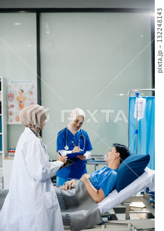 Muslim female doctors providing medical care in a modern clinic, with a focus on healthcare, patient treatment 132248143
