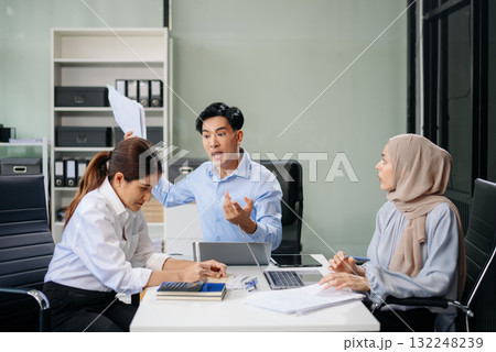Furious team Asian businesspeople arguing strongly after making a mistake at work in office Furious team Asian businesspeople arguing strongly after making a mistake at work in office 132248239