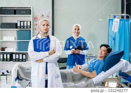 Muslim female doctors providing medical care in a modern clinic, with a focus on healthcare, patient treatment Muslim female doctors providing medical care in a modern clinic, with a focus on healthcare, patient treatment 132248277