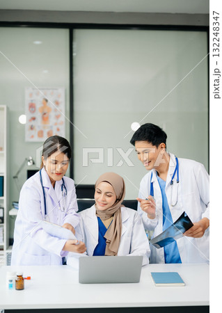 Medical professionals in modern clinic, discussing treatment and prescriptions. Healthcare, teamwork, consultation, diagnosis, and therapy and people team 132248347