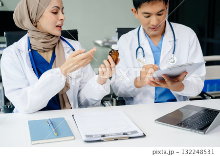 Medical, meeting and doctors with laptop for research, planning and hospital schedule management. Health, professional and people team Medical, meeting and doctors with laptop for research, planning and hospital schedule management. Health, professional and people team 132248531