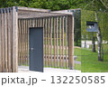Modern architectural structure with wooden elements and reflective surfaces. 132250585