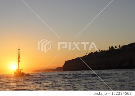 Golden Sunset Over Algarve Coastline Cliffs Golden Sunset Over Algarve Coastline Cliffs 132254563