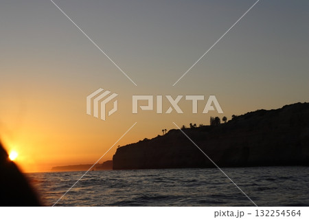 Golden Sunset Over Algarve Coastline Cliffs Golden Sunset Over Algarve Coastline Cliffs 132254564