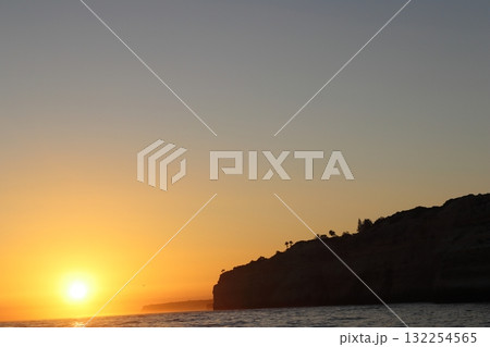 Golden Sunset Over Algarve Coastline Cliffs 132254565