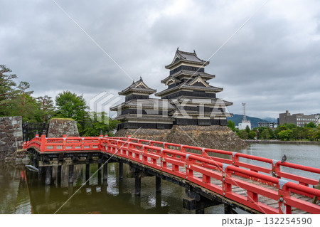 Red bridge leading to majestic Matsumoto Castle in Japan Red bridge leading to majestic Matsumoto Castle in Japan 132254590
