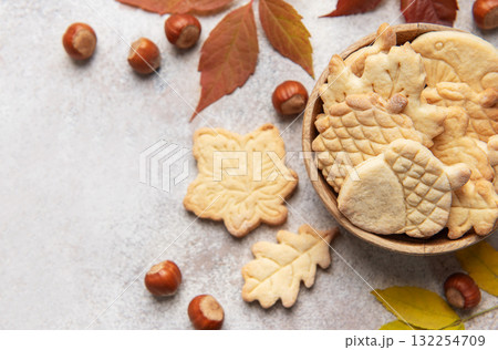 Autumn cookies with nuts and colorful leaves Autumn cookies with nuts and colorful leaves 132254709