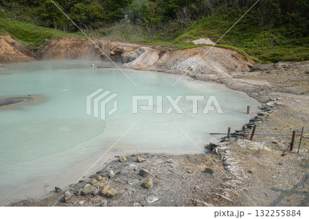 Geothermal hot spring pool in natural outdoor volcanic landscape at Oyunuma Pond, Noboribetsu, Hokkaido, Japan 132255884