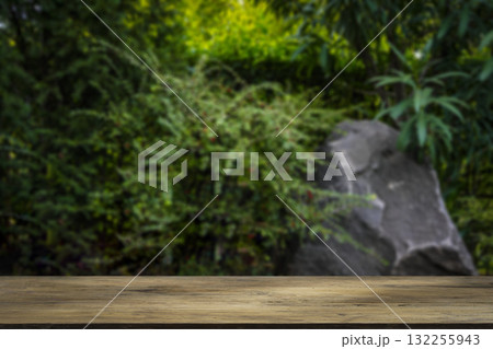 Wooden Table with Tropical Green Background. Natural Product Display Wooden Table with Tropical Green Background. Natural Product Display 132255943