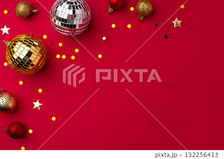 Christmas gold ornaments on a red background. 132256413