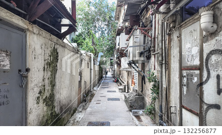 Oct 16 2025 Narrow Urban Alley With Weathered Walls, Outdoor Equipment, A Oct 16 2025 Narrow Urban Alley With Weathered Walls, Outdoor Equipment, A 132256877