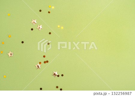 Gold confetti on green background Gold confetti on green background 132256987