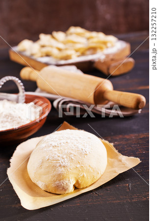 Fresh dough on a board 132257210