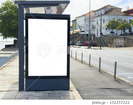 Billboard panel stands in Porto bus station. Modern blank vertical signage with glass display offers 132257222