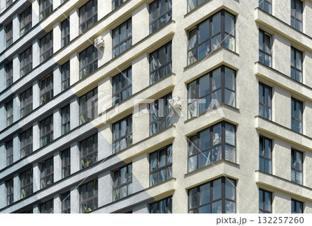 Building stands tall in urban district. Modern concrete highrise architecture features patterned 132257260