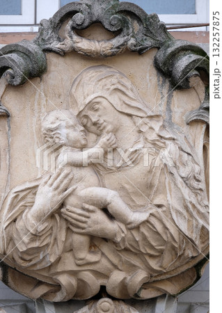 Virgin Mary with baby Jesus, statue on the house facade in Graz, Styria, Austria 132257875