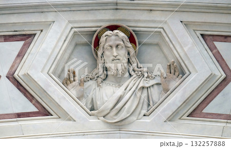 Jesus Christ, relief on the facade of Basilica of Santa Croce (Basilica of the Holy Cross) - famous Franciscan church in Florence, Italy 132257888