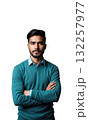 A Latinx business leader in teal, arms folded as golden financial symbols and abstract blueprints of success emerge around him 132257977