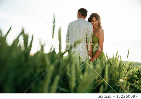 Non urban scene. Lovely couple are on the agricultural field together 132260097