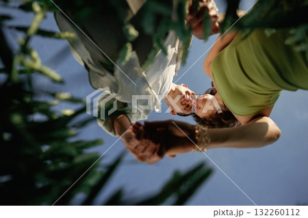 View from below of couple that is standing in the agricultural field View from below of couple that is standing in the agricultural field 132260112