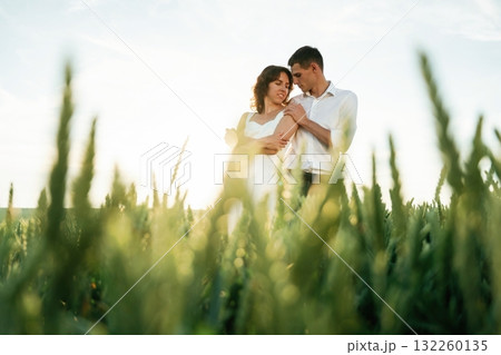 High wheat. Lovely couple are on the agricultural field together 132260135