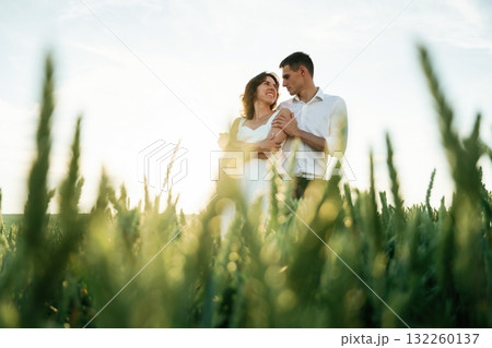 High wheat. Lovely couple are on the agricultural field together 132260137