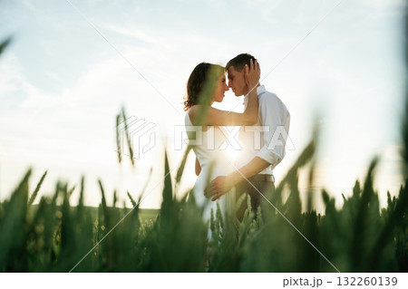 High wheat. Lovely couple are on the agricultural field together 132260139