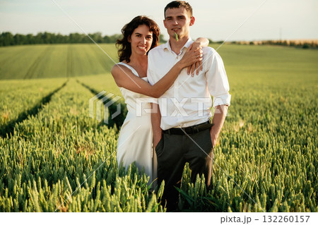 After the wedding. Lovely couple are on the agricultural field together 132260157