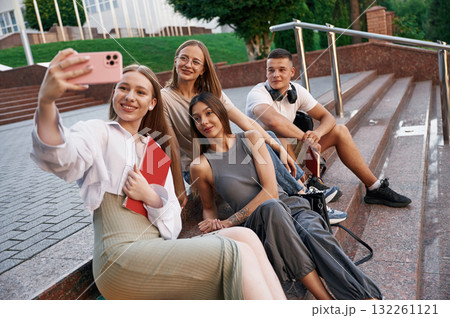 Making selfie. Group of students are outside together Making selfie. Group of students are outside together 132261121