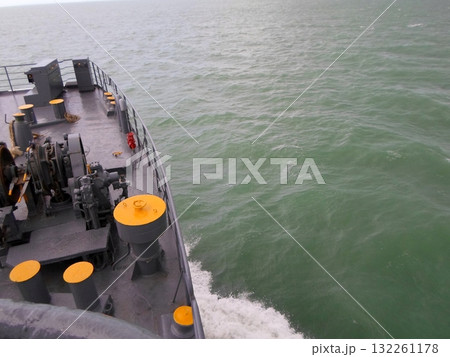 View of the Ocean from a Boat Deck with Equipment and Waves in the Foreground 132261178