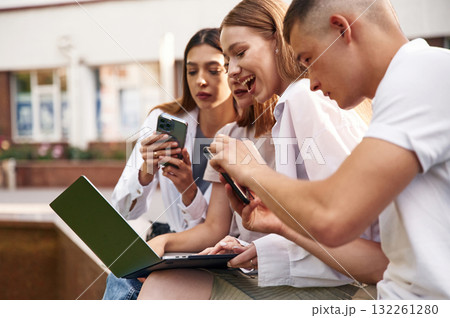 Conception of education. Group of students are outside together Conception of education. Group of students are outside together 132261280