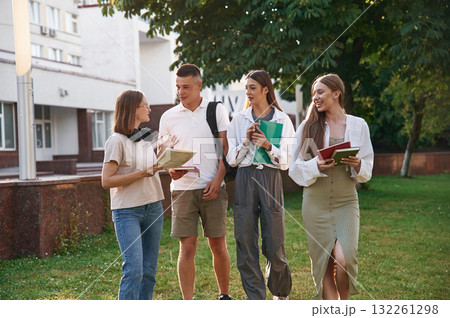 Bonding, positive emotions. Group of students are outside together Bonding, positive emotions. Group of students are outside together 132261298