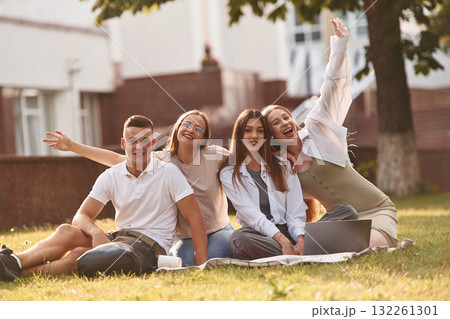 Bonding, positive emotions. Group of students are outside together 132261301