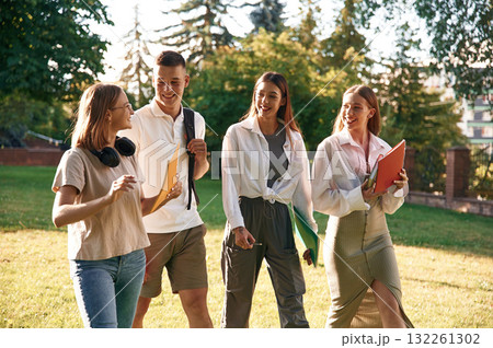 Bonding, positive emotions. Group of students are outside together 132261302